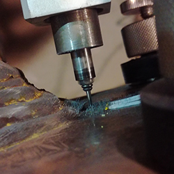Incremental hole-drilling on weld